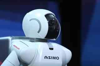 Asimo Robot, the man-made machine with a maiden name. He has a head.