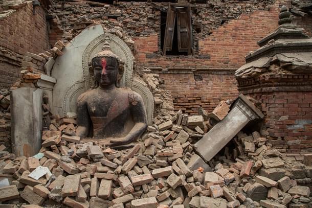 A Buddha statue is surrounded by debris from a collapsed temple in the UNESCO world heritage site of Bhaktapur on April 26, 2015 in Bhaktapur, Nepal. (Photo:Getty)