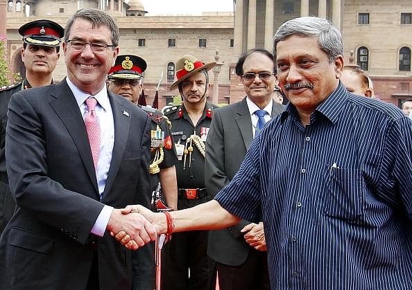 Carter with Mr. Parrikar/Getty Images