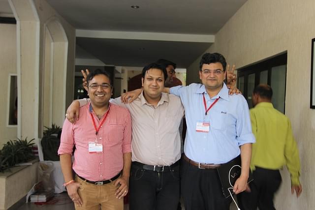Anand Ranganathan and Rahul Roushan pose for a photograph with a participant from Bangladesh.