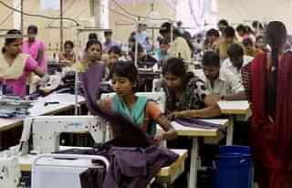 Workers at a garment factory.  (Manjunath Kiran/AFP/Getty Images)