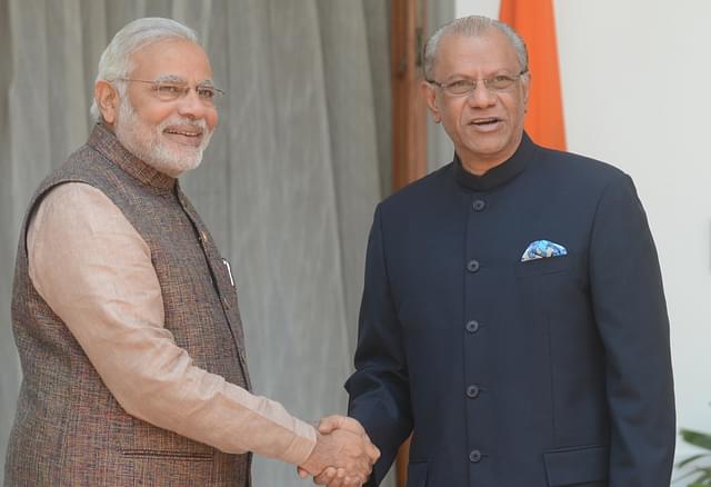 

 Prime Minister Narendra Modi (L) shakes hands with Mauritius Prime Minister Navinchandra Ramgoolam. [Photo: RAVEENDRAN/AFP/Getty Images]