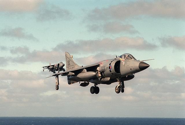 A British Royal Navy Sea Harrier comes in to land vertically.