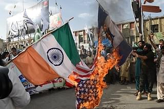 Jamaat-ud-Dawa members burning the flags of India, U.S and Israel to celebrate Pakistan’s independence day on Aug. 14, 2015. (BANARAS KHAN/AFP/Getty Images)&nbsp;