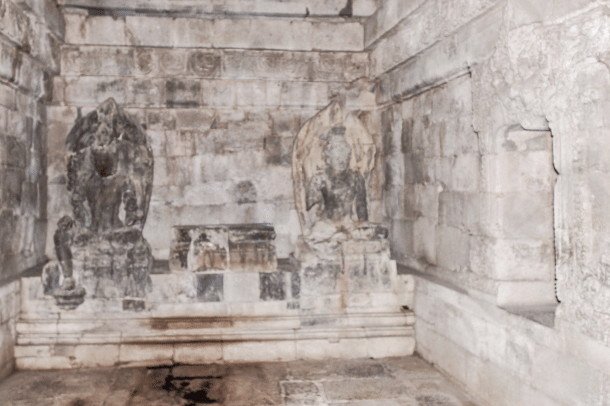 <b><i>Two Bodhisattva statues with the center one missing in one of the main temples</i></b>  .
