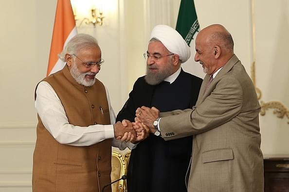 Modi with Iran’s Rouhani and Afghanistan’s Ashraf Ghani, signing the Chahbahar Treaty (Pool / Iran Presidency/Anadolu Agency/GettyImages)