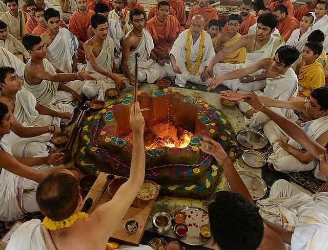 
Indian students and their Gurus,teachers, perform a ritual at a 
Swaminarayan Gurukul Vishwavidya Pratisthanam (SGVP) temple . Getty Images

