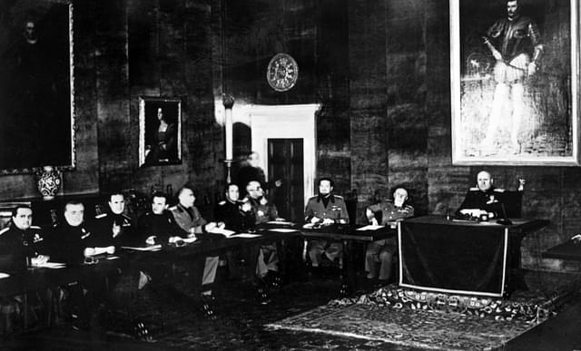 Picture taken on 15 April 1939 of Benito Mussolini (R) and members of the Grand Council of Fascism during a meeting. Italian dictator Benito Mussolini and his National Fascist Party came to power through a coup d’état on 28 October 1922. AFP/Getty Images