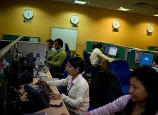 Indian staff work at a call-centre in Gurgaon on the outskirts of New Delhi. Getty Images