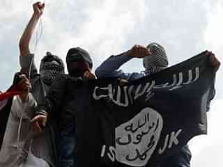 ISIS flags being waved by stone pelters in Kashmir.(TAUSEEF MUSTAFA/AFP/Getty Images)&nbsp;