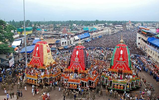 Devotees gather as
three giant chariots are pulled during the Rath Yatra of Lord Jagannath in Puri.
(Photo credit should read STR/AFP/GettyImages)