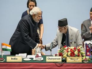 Narendra Modi greets Sushil Koirala, Prime Minister of Nepal (Photo: Pool/Getty Images)