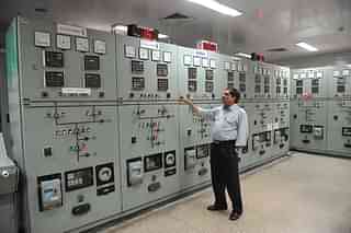 Gujarat State Electricity Corporation Limited deputy engineer
Ashokbhai Pandya shows the control panels at the Underground Riverbed Power
House of Hydro Power Narmada Project which generates electricity from Sardar
Sarovar Narmada Dam. Photo credit: SAM PANTHAKY/AFP/Getty Images)&nbsp;