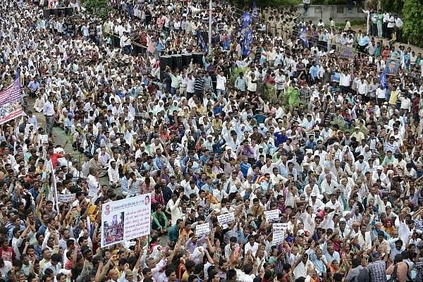 Indian members of the Dalit caste community join attend a protest rally against an attack on Dalit caste members in the Gujarat town of Una, in Ahmedabad on July 31, 2016. (SAM PANTHAKY/AFP/Getty Images)