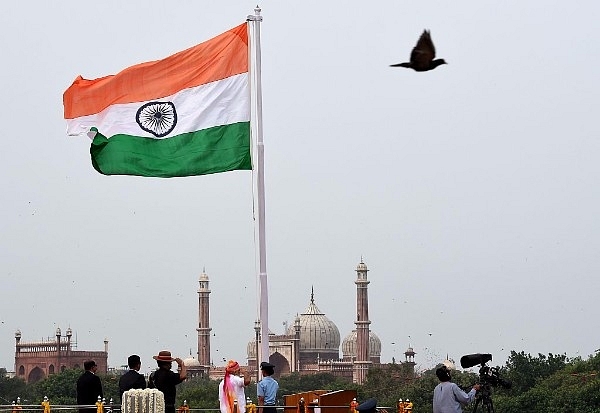 Indian Prime Minister Narendra Modi salutes as he unfurls the Indian national flag before delivering his Independence Day speech from The Red Fort in New Delhi on 15 August 2016. (MONEY SHARMA/AFP/Getty Images)
