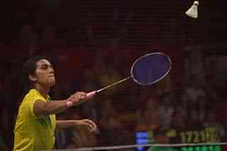 

P.V. Sindhu (L) of India hits a return against Li Xuerui of China during their round of 16 women’s singles match of the 2015 World Championships badminton tournament in Jakarta on August 13, 2015. AFP PHOTO / ADEK BERRY (Photo credit should read ADEK BERRY/AFP/Getty Images)