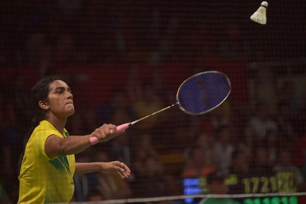P.V. Sindhu (L) of India hits a return against Li Xuerui of China during their round of 16 women’s singles match of the 2015 World Championships badminton tournament in Jakarta on August 13, 2015. AFP PHOTO / ADEK BERRY (Photo credit should read ADEK BERRY/AFP/Getty Images)
