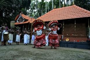 Photo: Teyyam, Kerala (Wikimedia Commons)