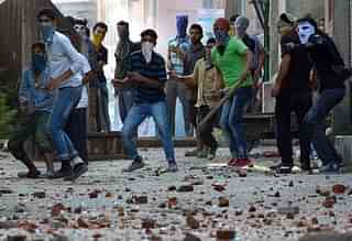 ‎ Kashmiri
protestors hold rocks as they clash with Indian security forces in Batmaloo
area. Photo credit: TAUSEEF MUSTAFA/AFP/GettyImages &nbsp; &nbsp;  