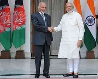 Ghani shakes hands with Modi in New Delhi. Photo credit:
STRDEL/AFP/GettyImages