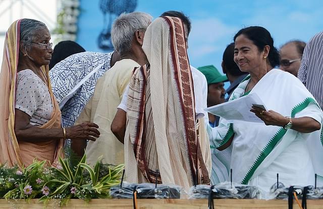 Banerjee delivers
new ownership documents to farmers who had previously owned land in the area
during a function near a Tata Nano Plant in Singur. Photo credit: DIBYANGSHU
SARKAR/AFP/GettyImages