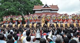 Thousands of Pooram fans watch the processions led by caparisoned
elephants in front of Vadakkunnathan
Temple in  Thrissur. Photo
credit: STRDEL/AFP/GettyImages