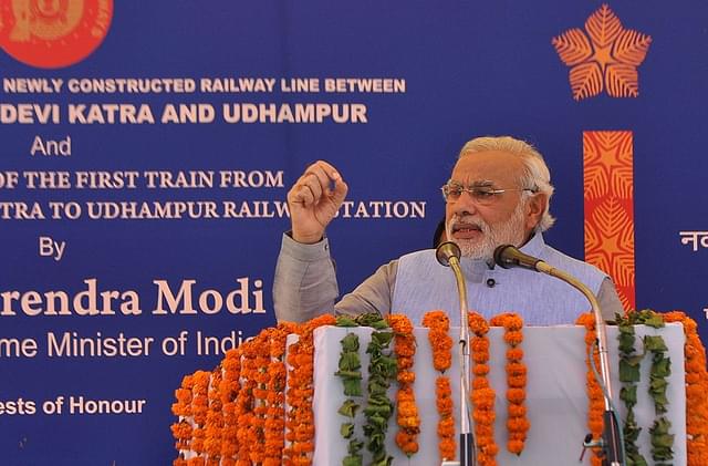 Prime Minister Narendra Modi speaks during the inauguration ceremony at Katra railway station, 45 km from Jammu. Photo credit: STR/AFP/GettyImages