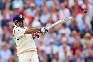 Mahendra Singh Dhoni pulls it (GLYN KIRK/AFP/Getty Images)