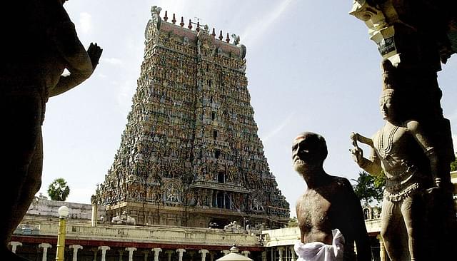 A devotee walks past the entrance to the Meenakshi temple in
Madurai (DIBYANGSHU SARKAR/AFP/GettyImages)