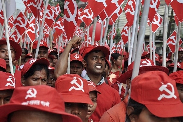Supporters of The Communist Party of India-Marxist (CPI-M) shout slogans during a rally. (ARINDAM DEY/AFP/Getty Images)