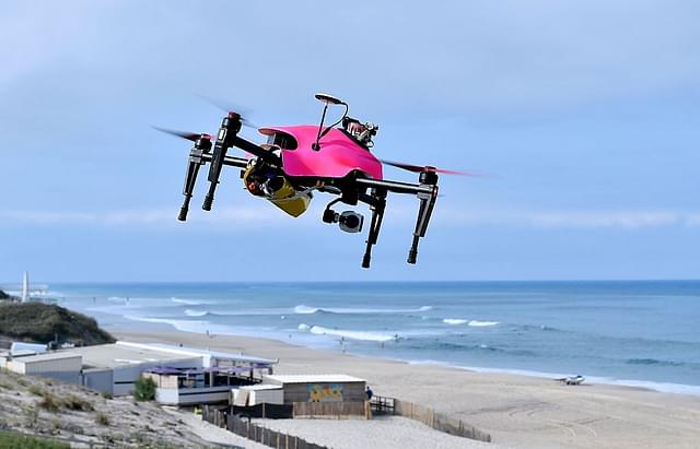 A surveillance drone flies over the beach of Biscarrosse, during
a demonstration of a rescue operation. Photo credit: GEORGES GOBET/AFP/GettyImages