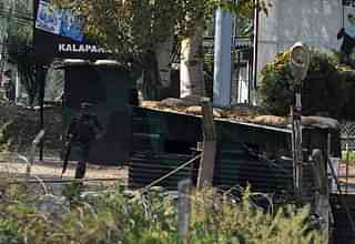 

An Indian army soldier runs through an army brigade headquarters during a gunbattle there between Indian army soldiers and rebels near the border with Pakistan, known as the Line of Control (LoC), in Uri on September 18, 2016. Militants armed with guns and grenades killed 17 soldiers in a raid September 18 on an army base in Indian-administered Kashmir, the worst such attack for more than a decade in the disputed Himalayan region. / AFP / TAUSEEF MUSTAFA (Photo credit: TAUSEEF MUSTAFA/AFP/Getty Images)
