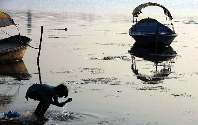 An Indian girl washes her hands in the river Ganga. Photo
credit: DIPTENDU DUTTA/AFP/GettyImages &nbsp; &nbsp; &nbsp;