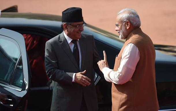 Indian Prime Minister Narendra Modi gestures while talking with Prime Minister of Nepal (Photo By:
PRAKASH SINGH/AFP/Getty Images)