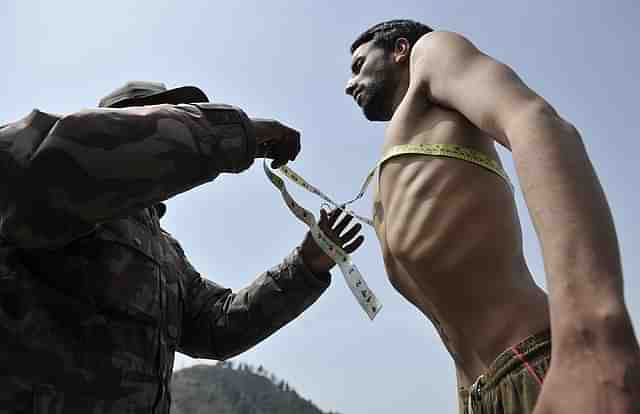 Representative image of a Kashmir youth at a recruitment rally (Photo credit: TAUSEEF MUSTAFA/AFP/GettyImages)