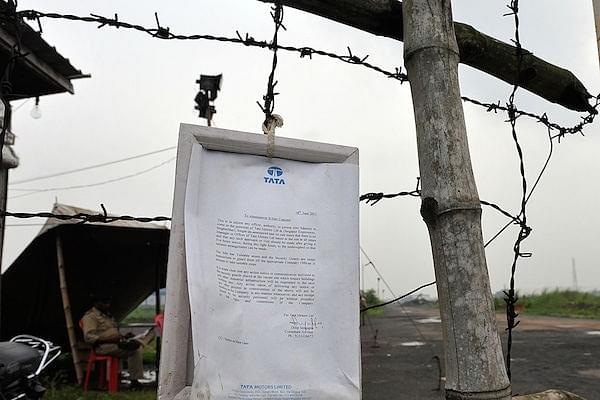 A notice pasted by the Tatas after the company was thrown out of Singur. DIBYANGSHU SARKAR/AFP/GettyImages)