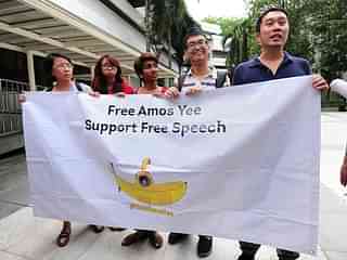 
Supporters of Singapore teenage blogger Amos Yee. Photo credit: MOHD FYROL/AFP/GettyImages.