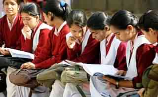 Indian schoolchildrenprepare for their CBSE senior school certificate examinations before enteringan examination hall in New Delhi. (RAVEENDRAN/AFP/GettyImages)
