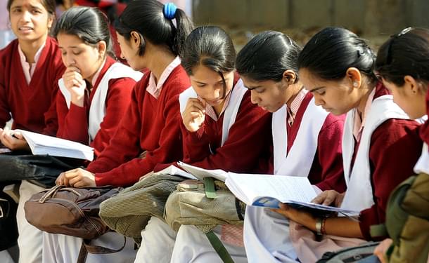 Indian schoolchildrenprepare for their CBSE senior school certificate examinations before enteringan examination hall in New Delhi (RAVEENDRAN/AFP/GettyImages)