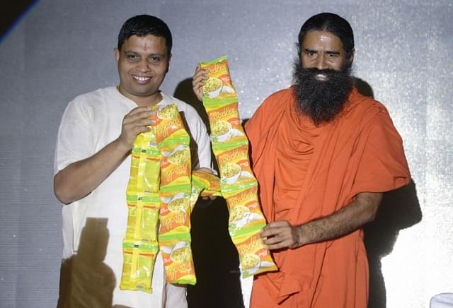 

Acharya Balkrishna and Baba Ramdev at the launch of a product.