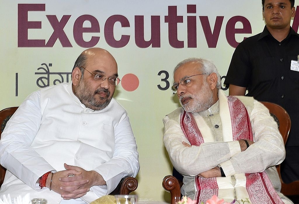 Amit Shah (L) and Narendra Modi (MANJUNATH KIRAN/AFP/Getty Images)