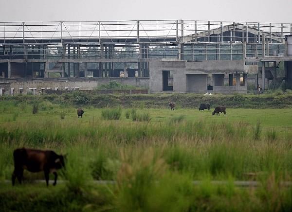 Cattle roam in front of a factory shed at the Tata Motors factory complex at Singur. (DESHAKALYAN CHOWDHURY/AFP/Getty Images)