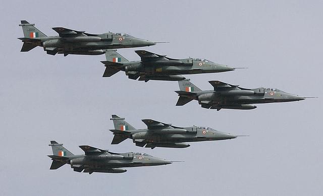 
Five Jaguar aircrafts in an arrowhead formation
 of the Indian Air Force fly over the Yehlanka Airforce Base. (Photo Credit: INDRANIL MUKHERJEE/AFP/Getty Images)

