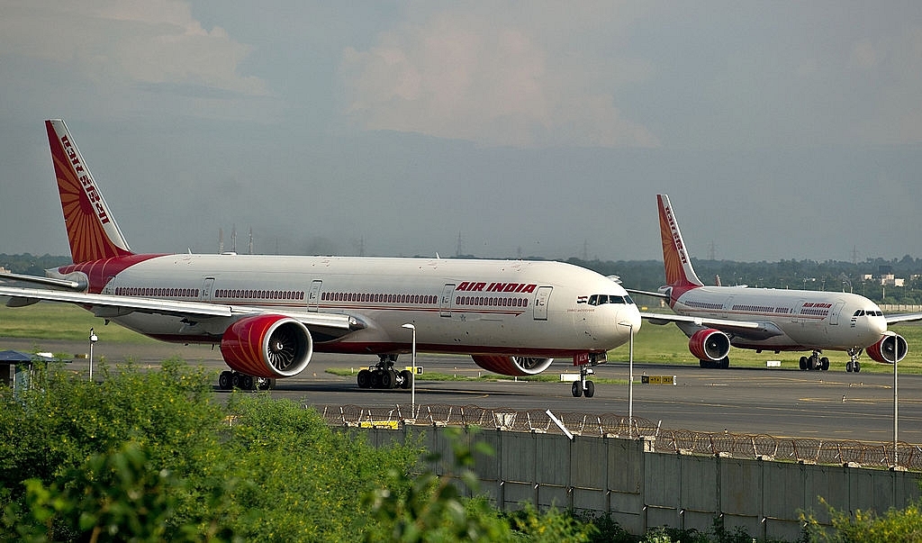 Air India planes prepare for take-off at the Indira Gandhi International Airport in New Delhi. (MANANVATSYAYANA/AFP/GettyImages)