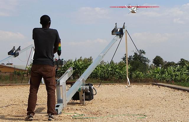 A technician of California-based robotics company Zipline launches a drone. (STEPHANIE AGLIETTI/AFP/Getty Images)