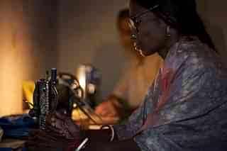 

Woman working by her sewing machine on candlelight (© Jorge Royan/<a href="http://www.royan.com.ar/">http://www.royan.com.ar</a>/<a href="http://creativecommons.org/licenses/by-sa/3.0/">CC BY-SA 3.0</a>)