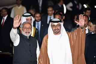 Prime Minister Narendra Modi (L) and Crown Prince of Abu Dhabi Sheikh Mohammed Bin Zayed Al Nahyan (R) wave to the crowd (PRAKASH SINGH/AFP/Getty Images)