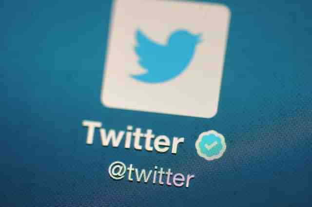 The Twitter logo is displayed on a mobile device. (Bethany Clarke/Getty Images) 