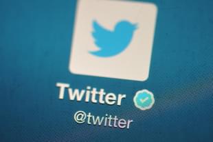 The Twitter logo is displayed on a mobile device. (Bethany Clarke/Getty Images)