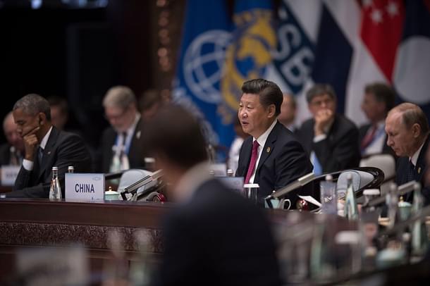Chinese President Xi Jinping (C) gives a speech whilst US President Barack Obama (L) and Russia’s President Vladimir Putin (R) listen. (NICOLAS ASFOURI/AFP/Getty Images) 